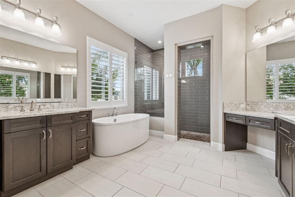 10605 Sabella Drive Trinity, FL 34655 - Photo 27 of 77 a large bathroom with a large tub shower and sink