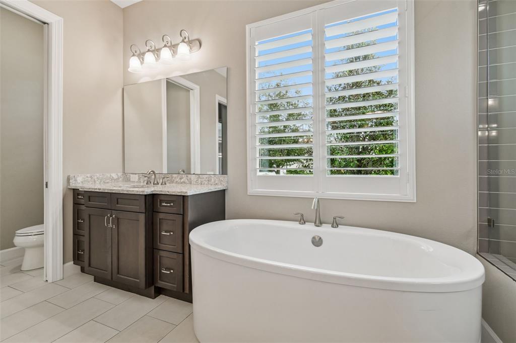 10605 Sabella Drive Trinity, FL 34655 - Photo 28 of 77 a bathroom with a sink and a toilet
