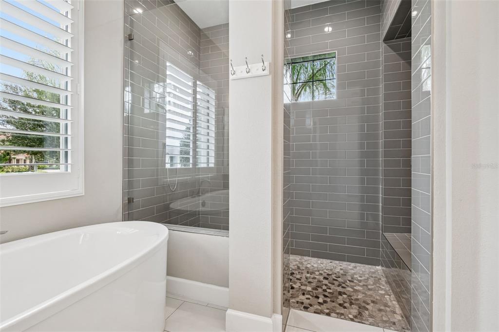 10605 Sabella Drive Trinity, FL 34655 - Photo 30 of 77 a bathroom with a bathtub and shower