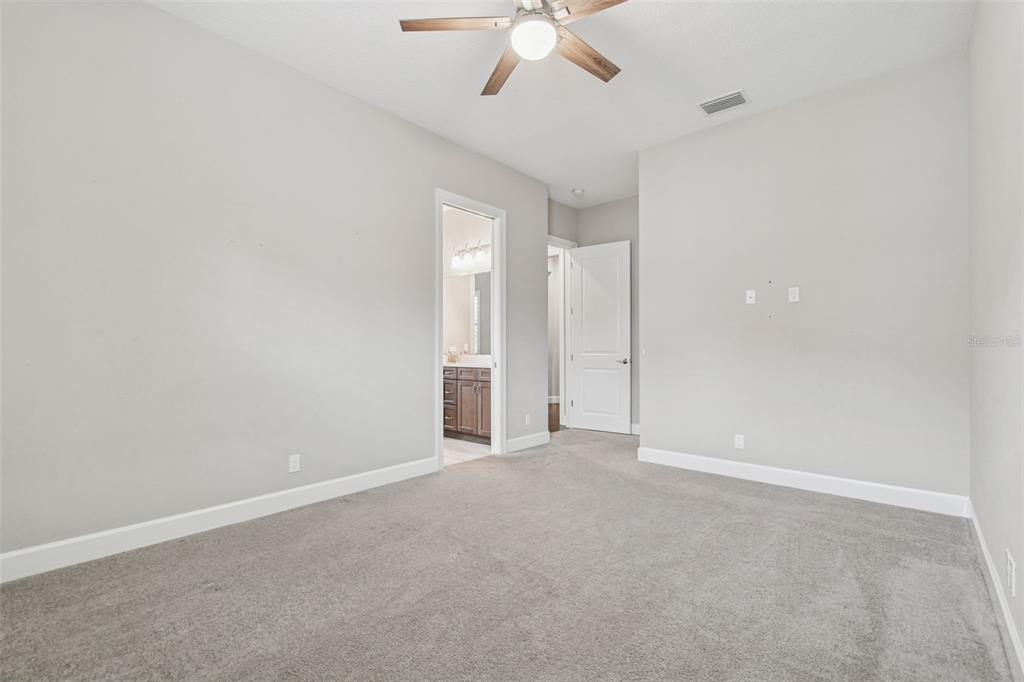 10605 Sabella Drive Trinity, FL 34655 - Photo 40 of 77 an empty room with chandelier fan