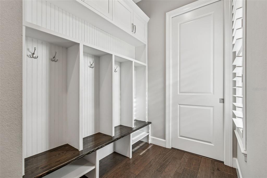 10605 Sabella Drive Trinity, FL 34655 - Photo 41 of 77 a room with wooden floor and windows