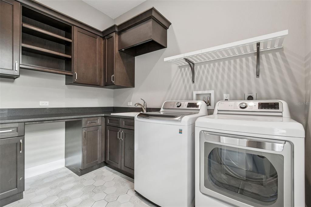 10605 Sabella Drive Trinity, FL 34655 - Photo 42 of 77 a utility room with dryer and washer