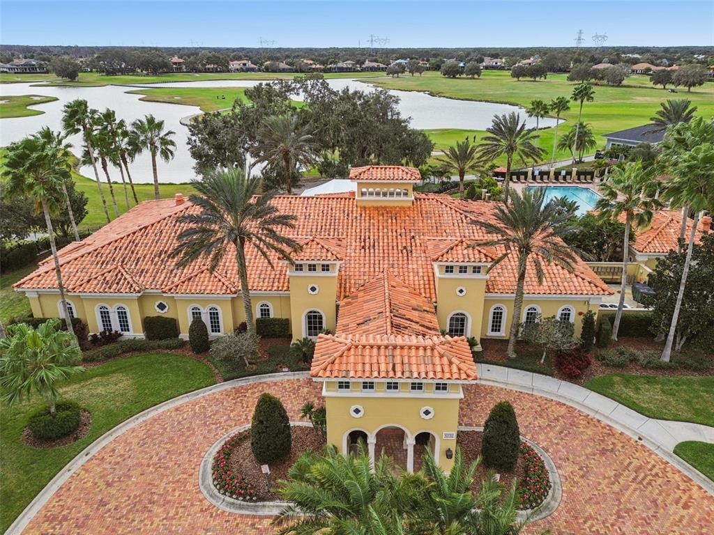 10605 Sabella Drive Trinity, FL 34655 - Photo 53 of 77 an aerial view of a house with garden space and lake view
