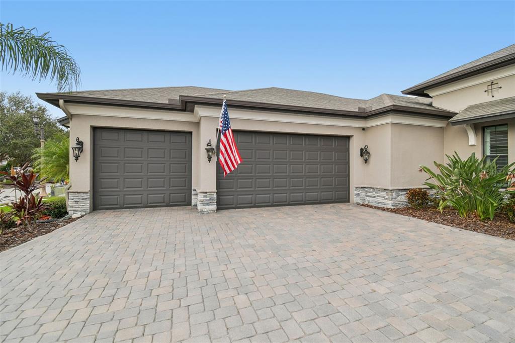 10605 Sabella Drive Trinity, FL 34655 - Photo 7 of 77 a front view of a house with a yard and garage