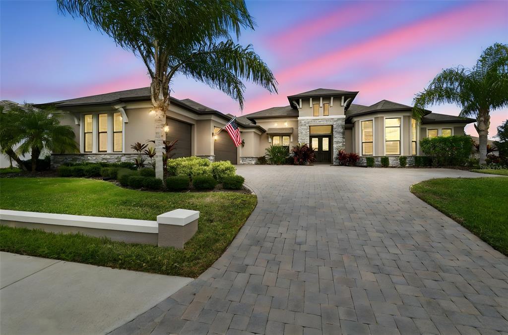10605 Sabella Drive Trinity, FL 34655 - Photo 77 of 77 a front view of a house with a yard and garage