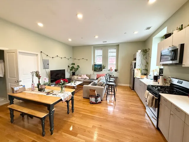 a living room with fireplace furniture and a flat screen tv