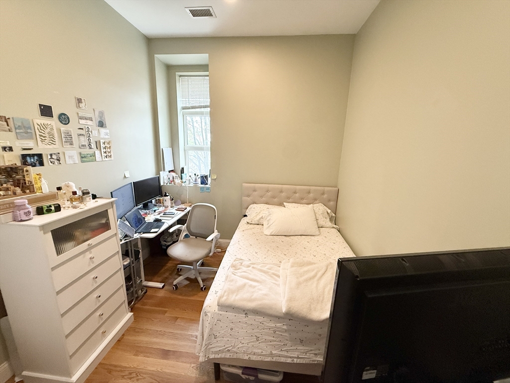 409 Dudley Street, Unit 4 Boston, MA 02119 - Photo 5 of 10 a en suite bathroom with a sink and a mirror