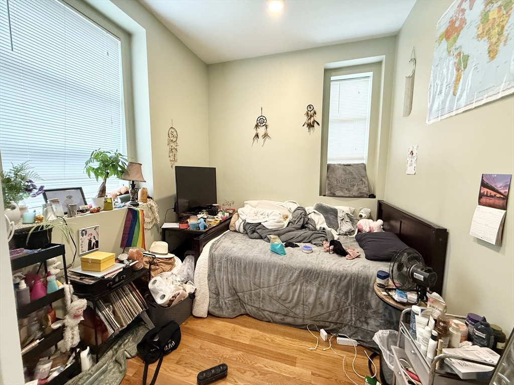 409 Dudley Street, Unit 4 Boston, MA 02119 - Photo 6 of 10 a bedroom with bed and a window