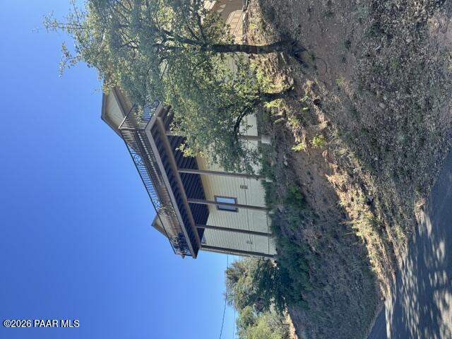 250 Anderson Road Prescott, AZ 86303 - Photo 1 of 17 a backyard of a house with lots of green space