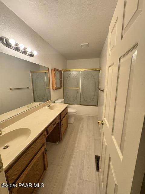 250 Anderson Road Prescott, AZ 86303 - Photo 12 of 17 a spacious bathroom with a granite countertop sink a toilet a mirror and shower