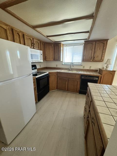 250 Anderson Road Prescott, AZ 86303 - Photo 6 of 17 a kitchen with stainless steel appliances granite countertop a refrigerator a stove top oven a sink and dishwasher