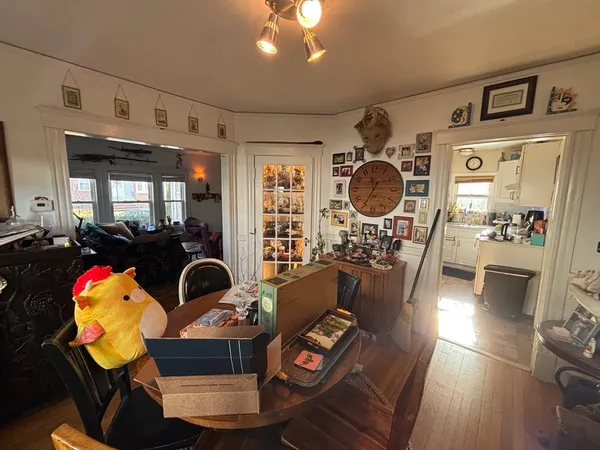 a living room with furniture and chandelier