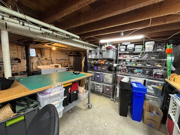a utility room with stainless steel appliances and living room