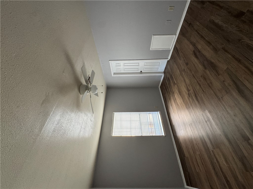 1008 Autumn Circle, Unit A College Station, TX 77840 - Photo 12 of 23 an empty room with wooden floor cabinet and windows