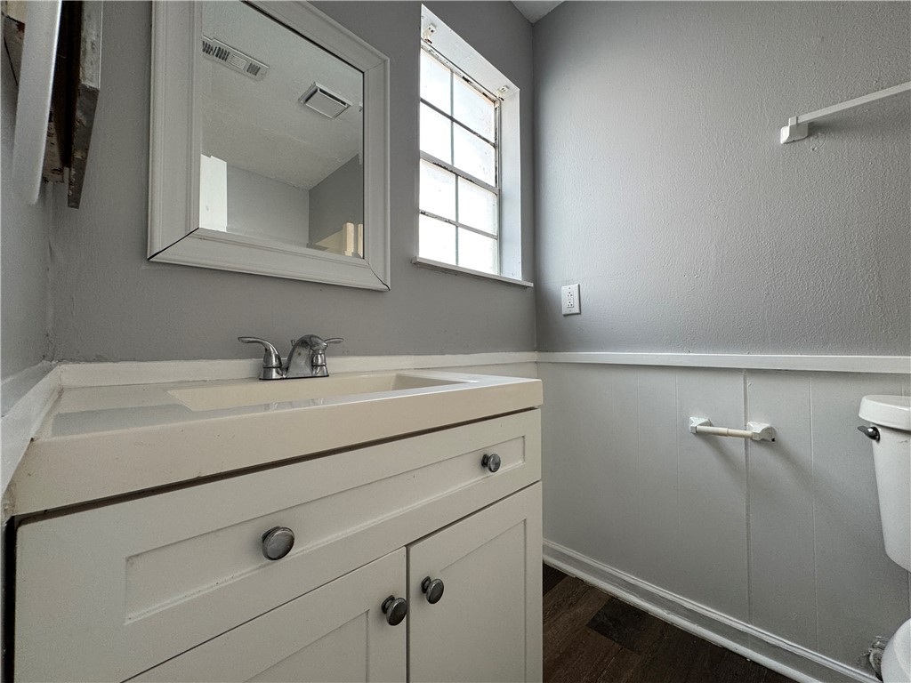 1008 Autumn Circle, Unit A College Station, TX 77840 - Photo 14 of 23 a bathroom with a sink and a mirror