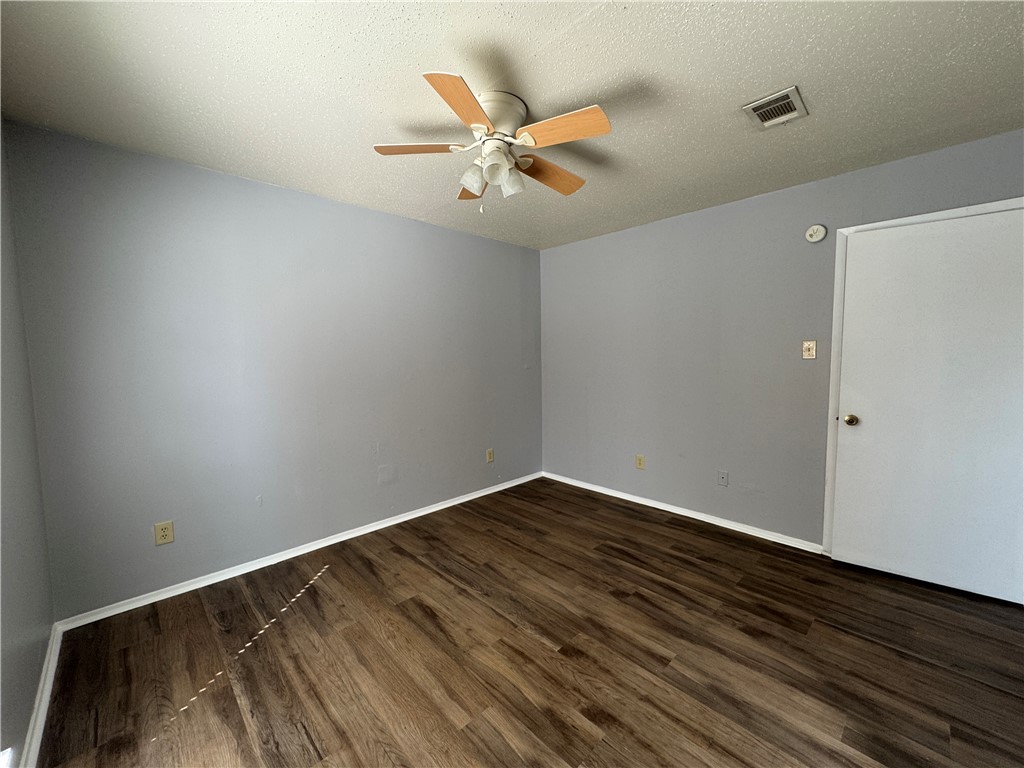 1008 Autumn Circle, Unit A College Station, TX 77840 - Photo 19 of 23 wooden floor in an empty room