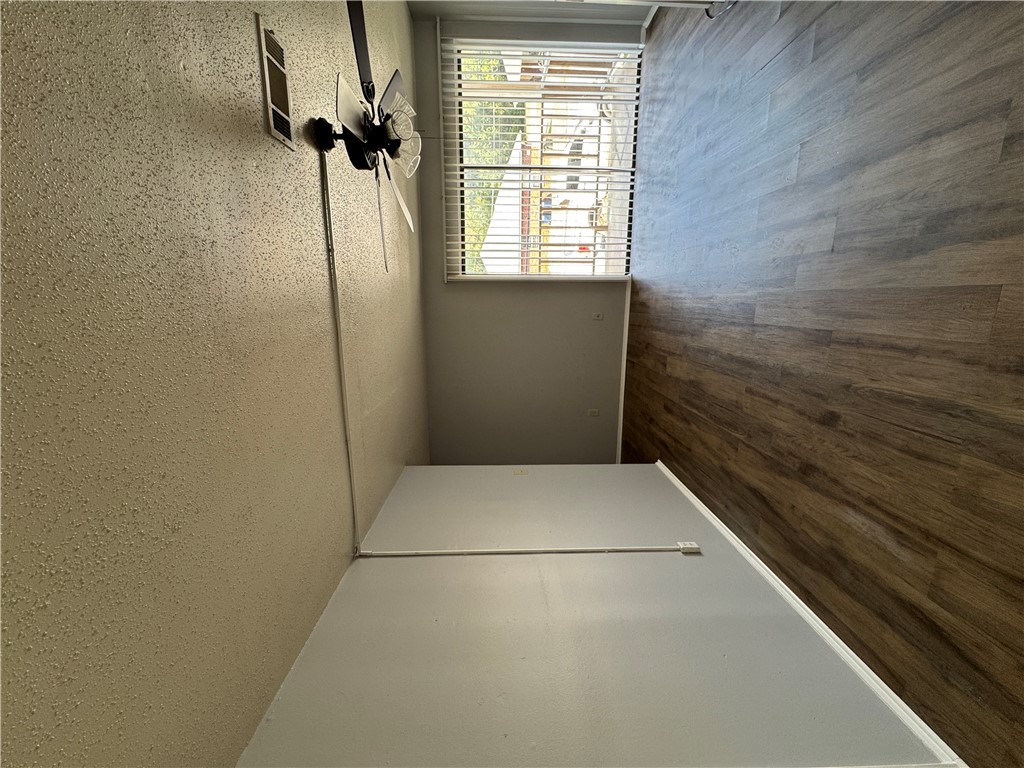 1008 Autumn Circle, Unit A College Station, TX 77840 - Photo 5 of 23 an empty room with wooden floor and windows