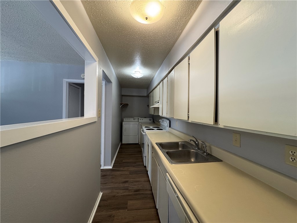1008 Autumn Circle, Unit A College Station, TX 77840 - Photo 8 of 23 a kitchen with a stove a sink and a refrigerator
