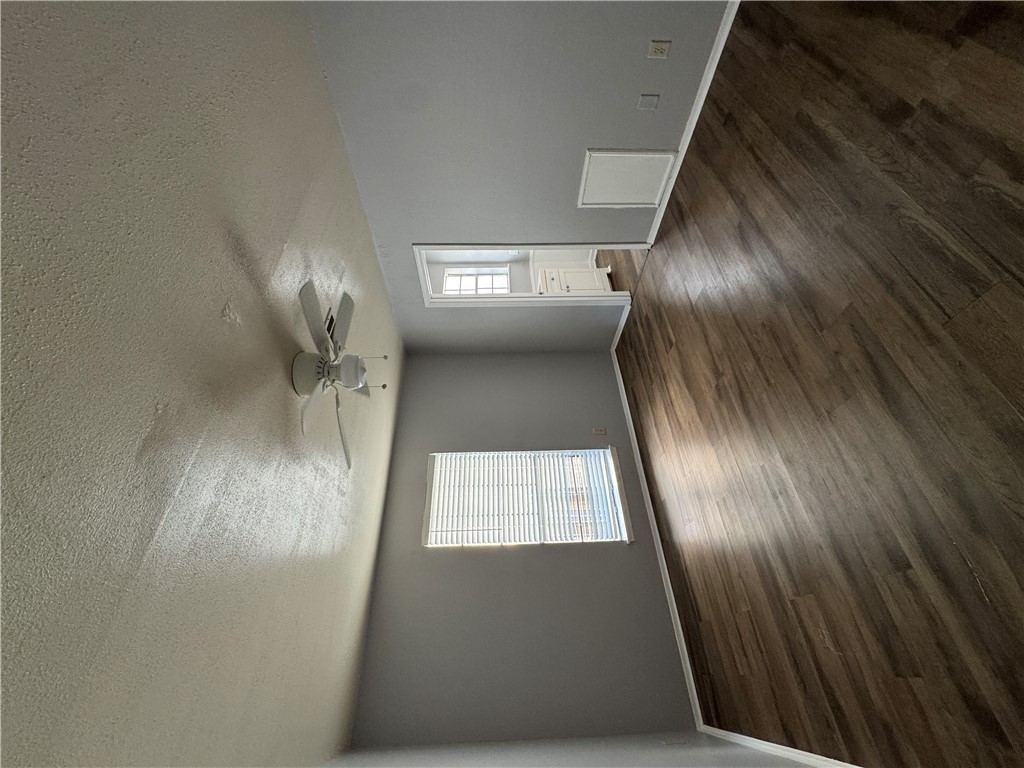1008 Autumn Circle, Unit A College Station, TX 77840 - Photo 10 of 23 an empty room with wooden floor and windows