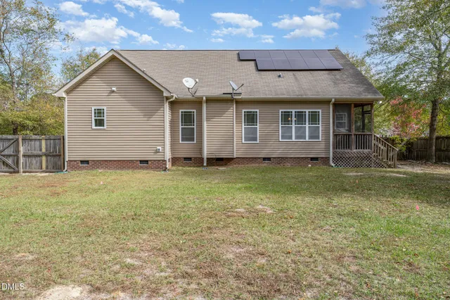 a view of a yard with a tree