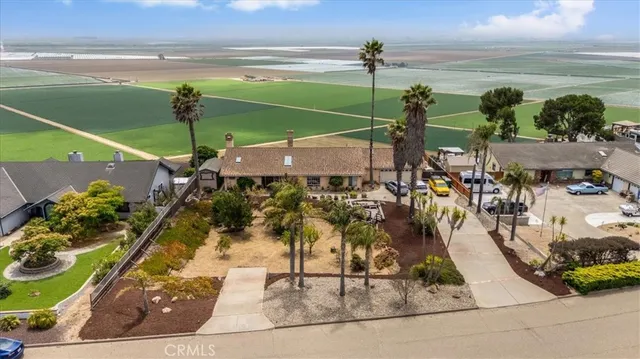 a view of a swimming pool with an outdoor seating
