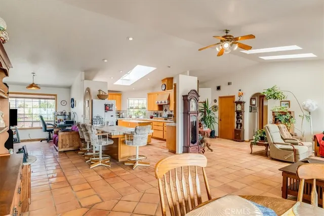 a view of a living room filled with furniture and window