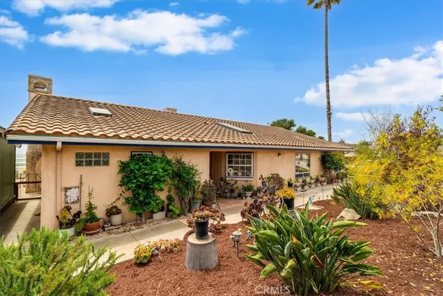 a view of a house with a small yard