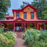 a front view of a house with garden