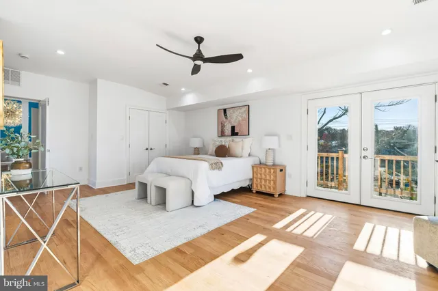 a large room with a lot of white furniture