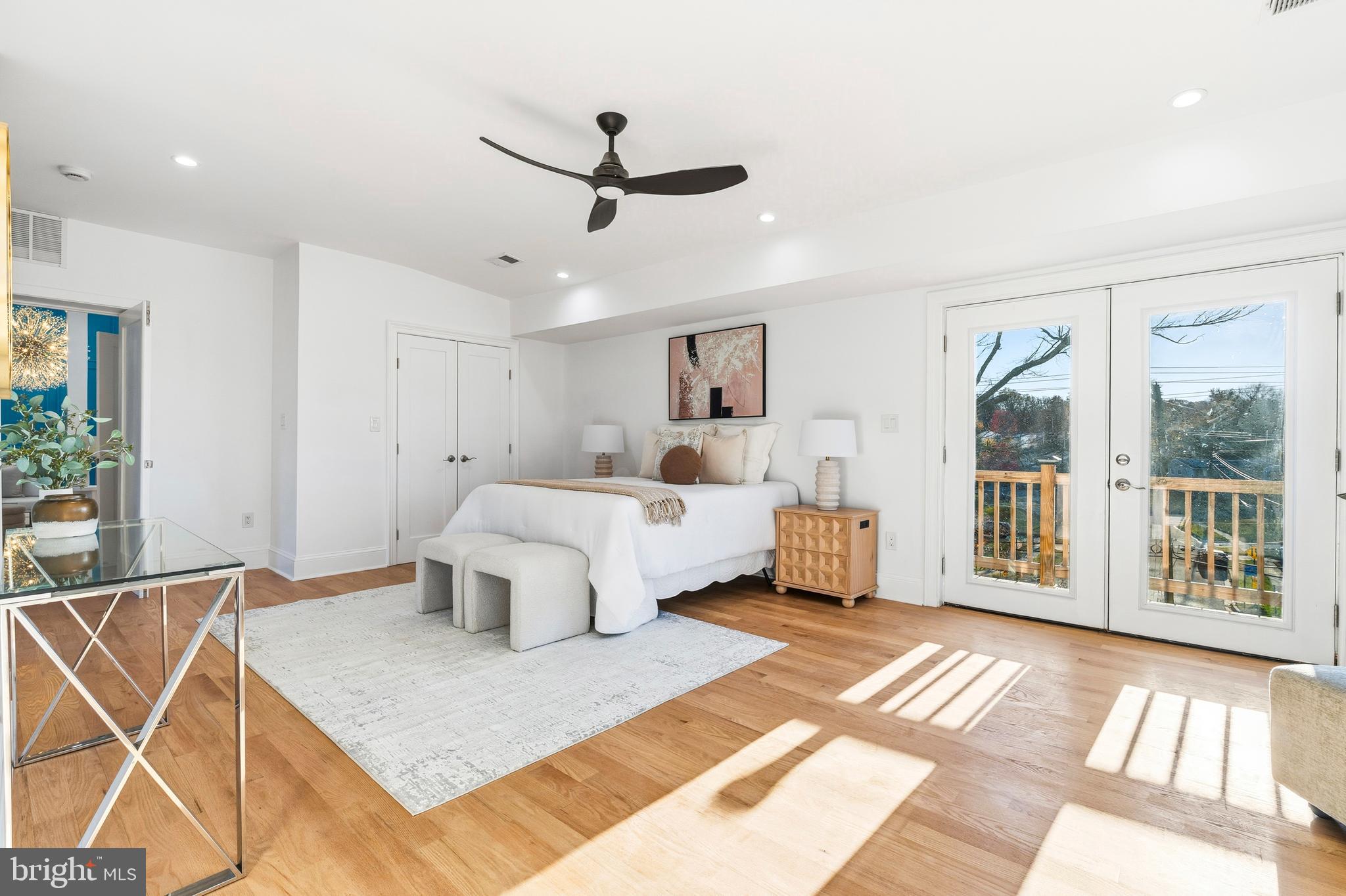 6218 Suitland Road Suitland, MD 20746 - Photo 21 of 52 a bedroom with a large bed a lamp and windows