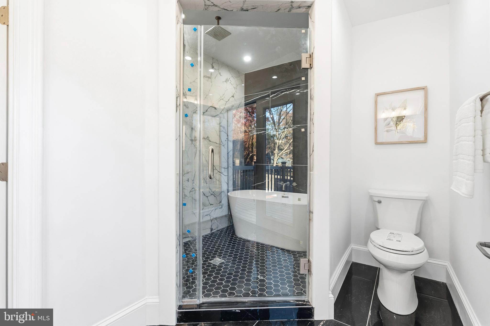 6218 Suitland Road Suitland, MD 20746 - Photo 24 of 52 a bathroom with a toilet and a shower