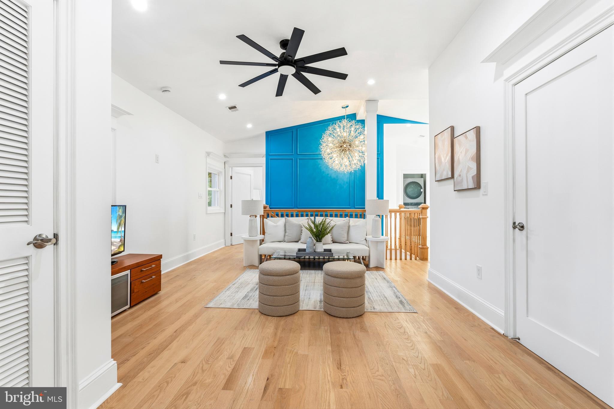 6218 Suitland Road Suitland, MD 20746 - Photo 28 of 52 a living room with furniture and a wooden floor