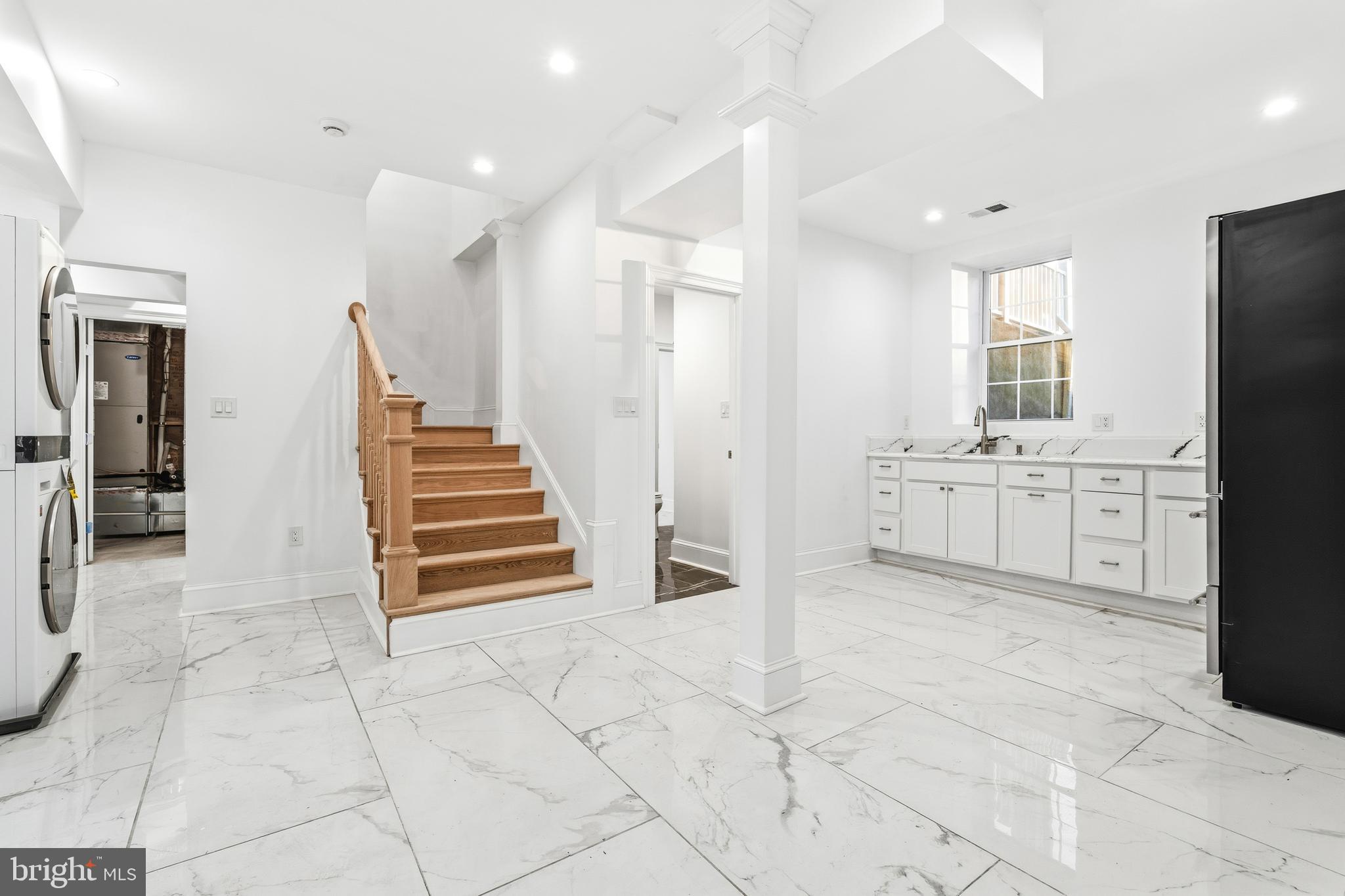 6218 Suitland Road Suitland, MD 20746 - Photo 39 of 52 a view of a kitchen with furniture and white cabinets