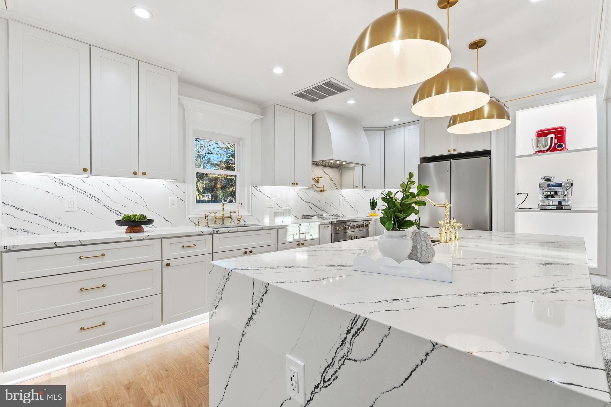 6218 Suitland Road Suitland, MD 20746 - Photo 10 of 52 a view of cabinets a potted plant and a kitchen countertops