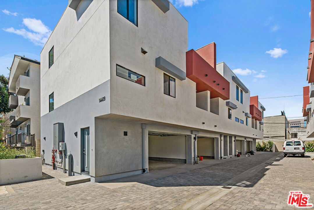 a front view of a building with many windows