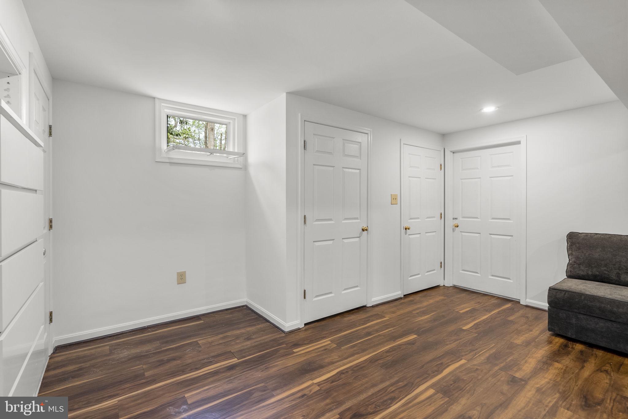 1210 Ashton Road Ashton, MD 20861 - Photo 50 of 71 a view of empty room with wooden floor