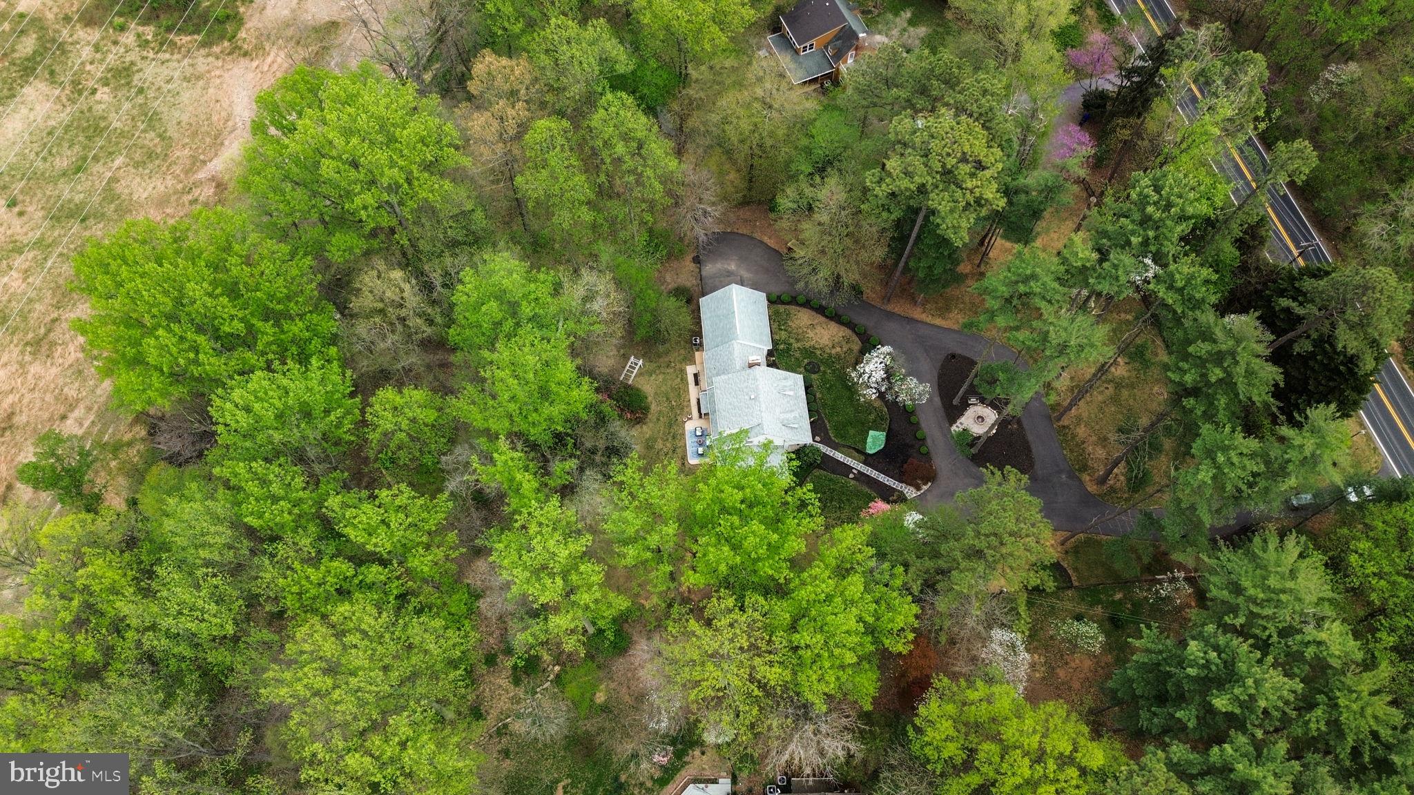 1210 Ashton Road Ashton, MD 20861 - Photo 58 of 71 an aerial view of a house with a yard and large trees