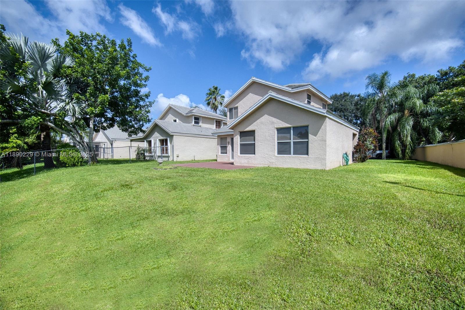 2913 Myrtle Oak Circle Davie, FL 33328 - Photo 11 of 35 a view of a house with a big yard