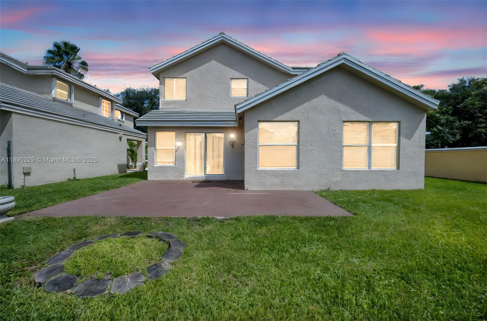 2913 Myrtle Oak Circle Davie, FL 33328 - Photo 14 of 35 a front view of a house with a yard