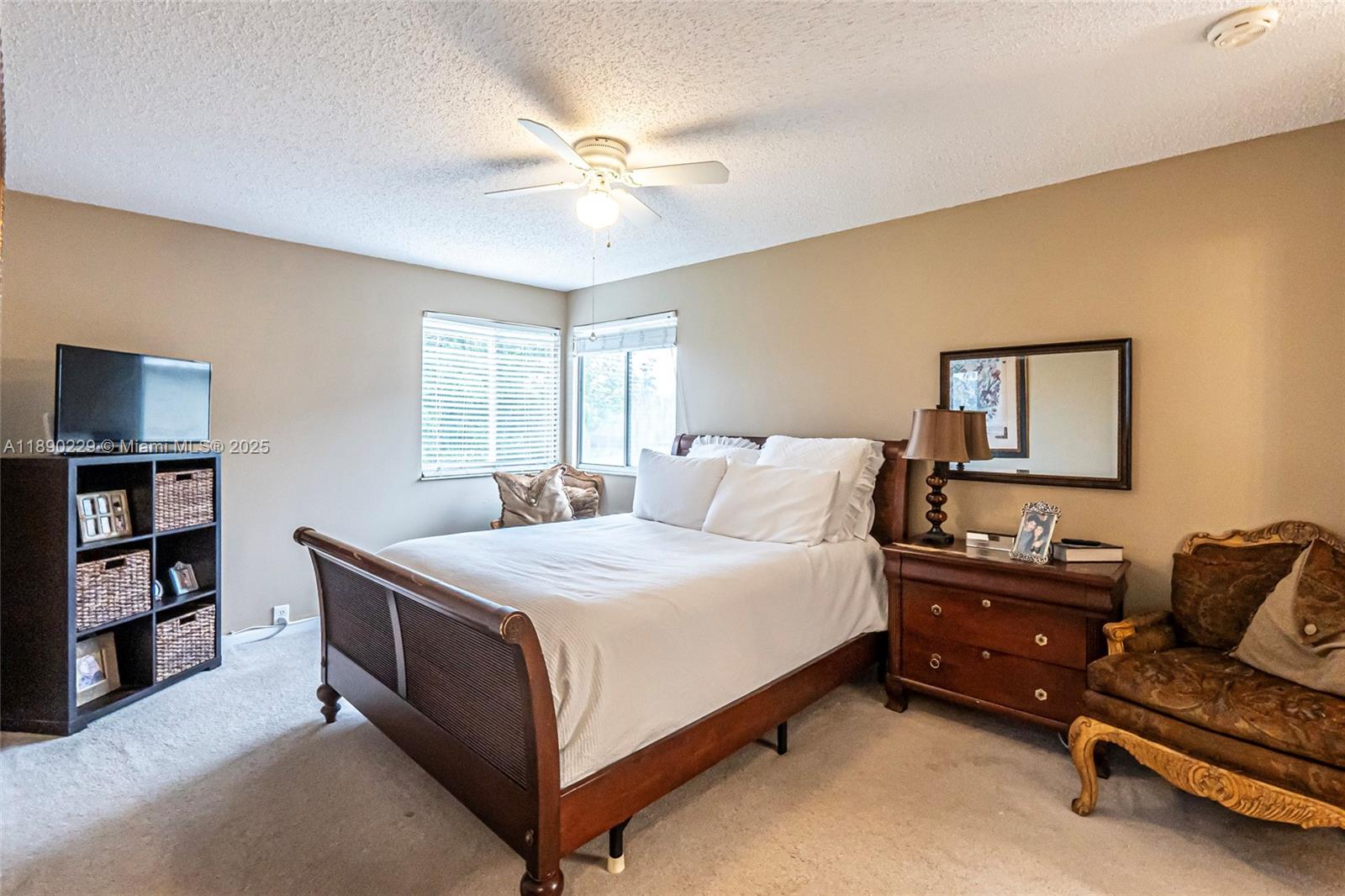 2913 Myrtle Oak Circle Davie, FL 33328 - Photo 24 of 35 a bedroom with a bed and a chandelier