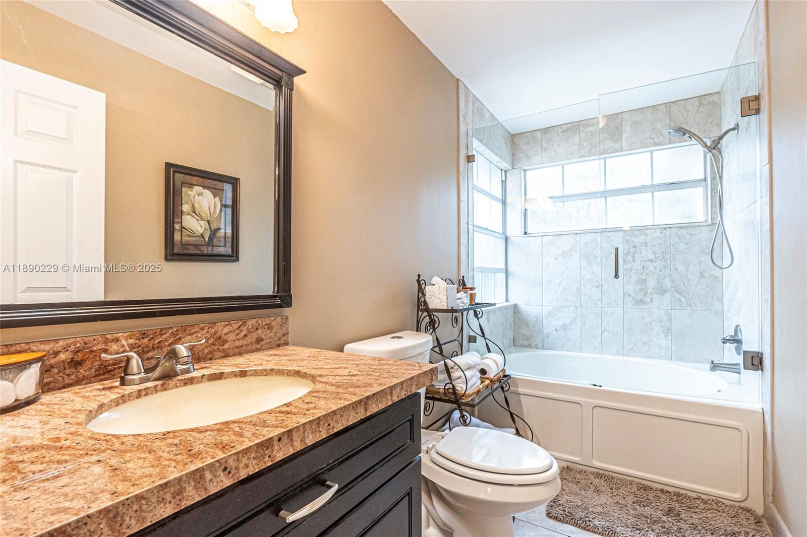 2913 Myrtle Oak Circle Davie, FL 33328 - Photo 25 of 35 a bathroom with a granite countertop sink toilet and shower