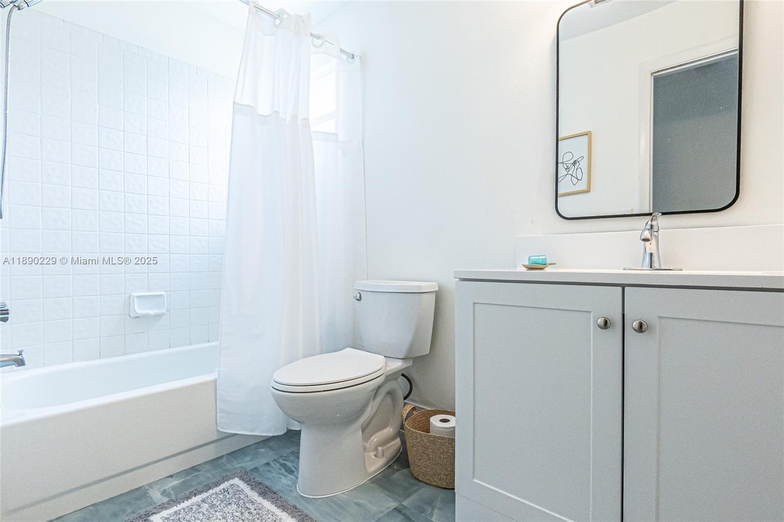 2913 Myrtle Oak Circle Davie, FL 33328 - Photo 28 of 35 a bathroom with a toilet sink and mirror