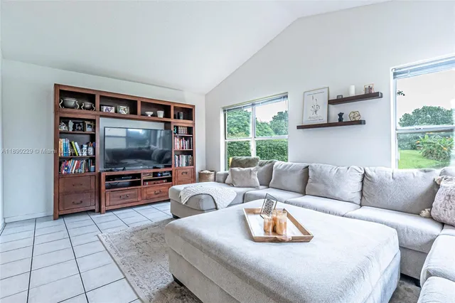 an aerial view of a house with garden space and street view