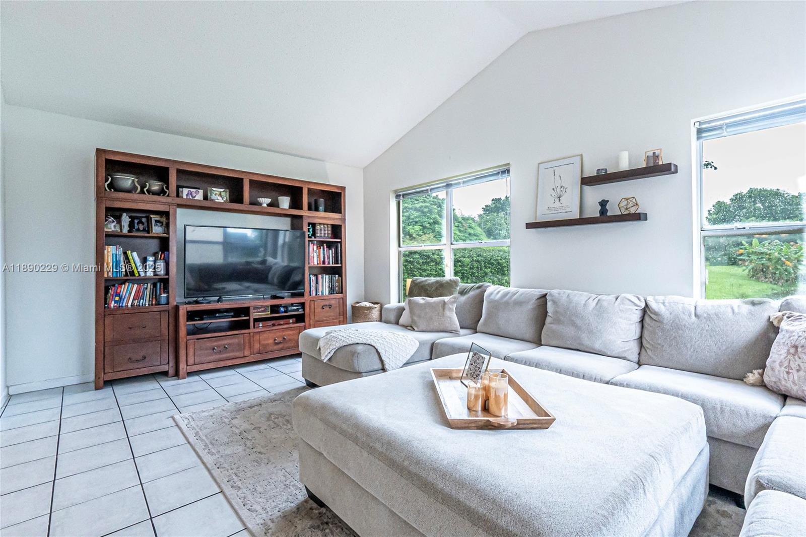 2913 Myrtle Oak Circle Davie, FL 33328 - Photo 6 of 35 a living room with furniture and a flat screen tv