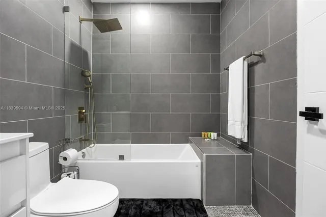 a bedroom with a large bed and a large window