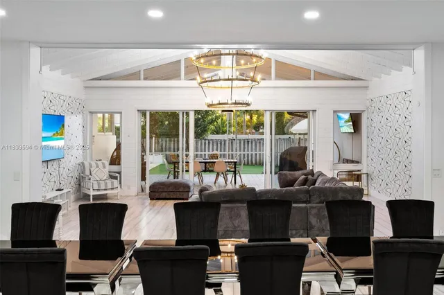 a view of a house with a yard patio and swimming pool