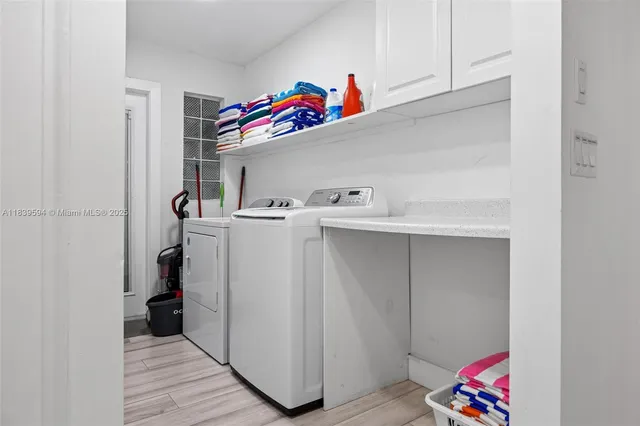 a bathroom with a toilet sink and shower