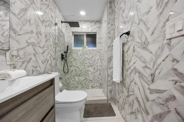 a view of a hallway with seating space