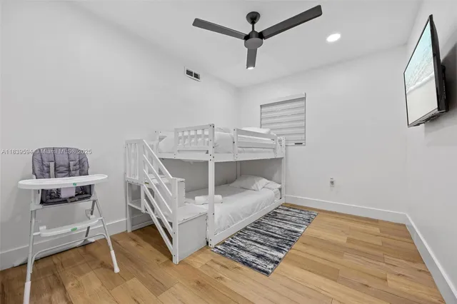 a room with pool table and a rug