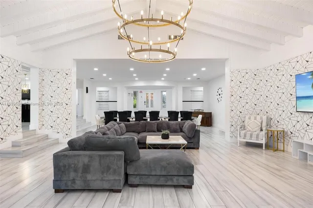 a view of a house with backyard sitting area and garden